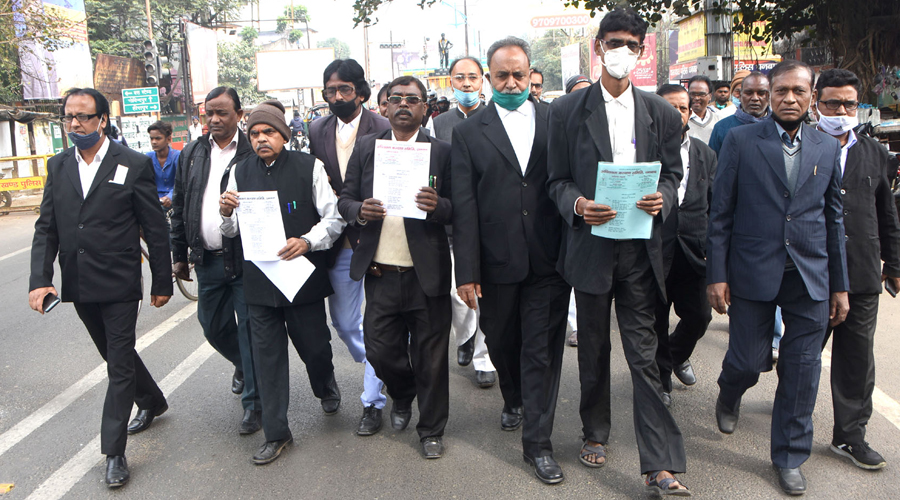 Lawyers of Dhanbad with the memorandum to open the court, on their way to hand over to the deputy commissioner of Dhanbad and CJM, Dhanbad on Monday.