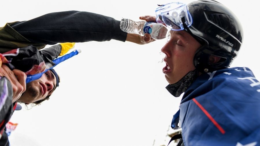 A trump supporter pours water in the eyes of another, who was affected due to the tear gas, on Wednesday, in Washington.