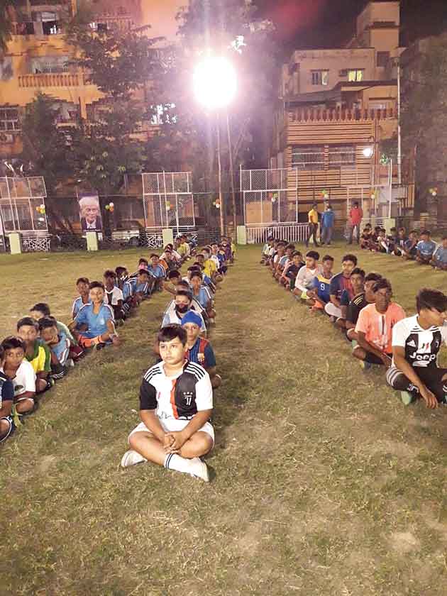 Children listen to instructions before being divided into teams