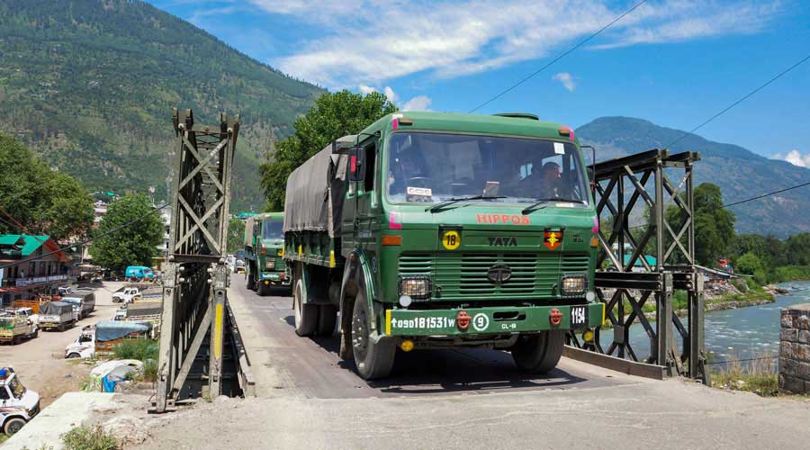 Indian army trucks depart towards Ladakh amid stand off between Indian and Chinese troops in eastern Ladakh, at Manali-Leh highway in Kullu district