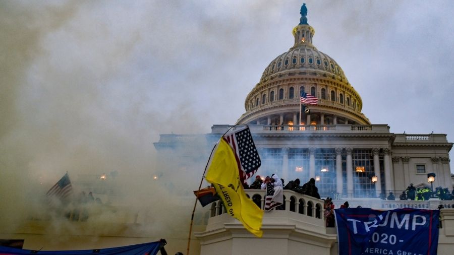 Authorities deploy tear gas on the mob that stormed the Capitol, on Wednesday, in Washington.