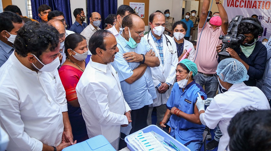 A medic administers the first dose of Covishield vaccine to a frontline worker in the presence of Union Minister of State for Home Affairs G Kishan Reddy and other ministers, at Gandhi Hospital in Hyderabad.