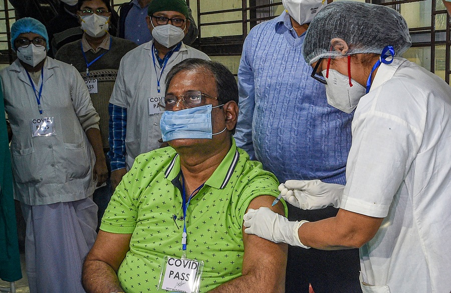 A medic administers the COVID-19 vaccine to a frontline worker, at Calcutta Medical College.