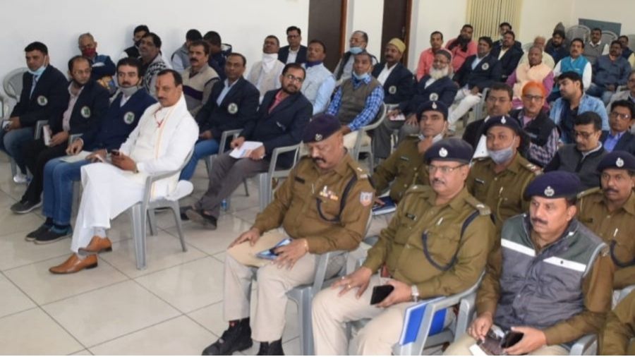 Police officers and traders attend the meeting in Dhanbad on Sunday. 