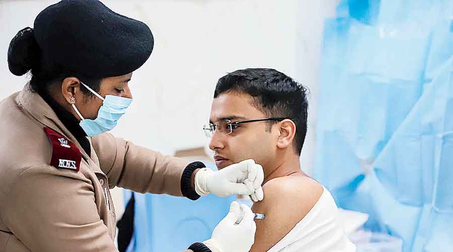 A jawan receives a dose of Covishield vaccine at a military hospital in Allahabad on Monday