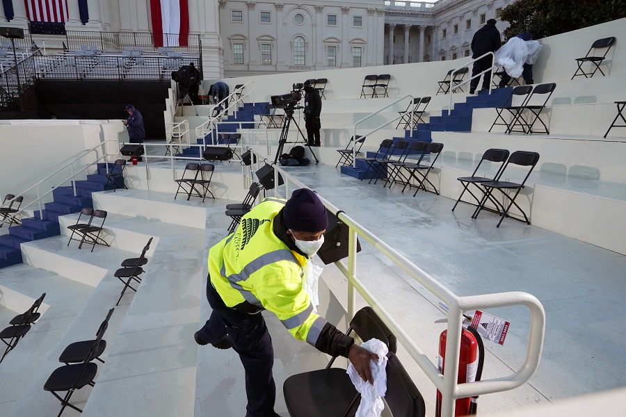 Man sanitises the premises of the White House in Washington on Wednesday morning, where Joe Biden was sworn in as the President of the United States.
