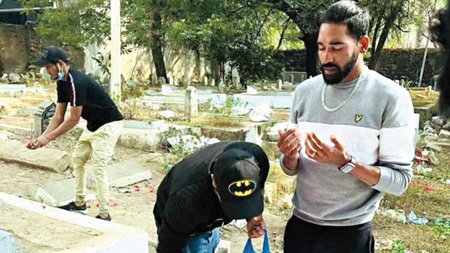 Mohammed Siraj praying at his father’s grave in  Hyderabad on Thursday.