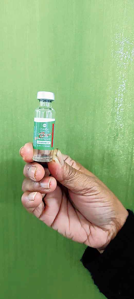 An official holds a vial of Covishield at Bidhannagar Subdivisional Hospital on Saturday