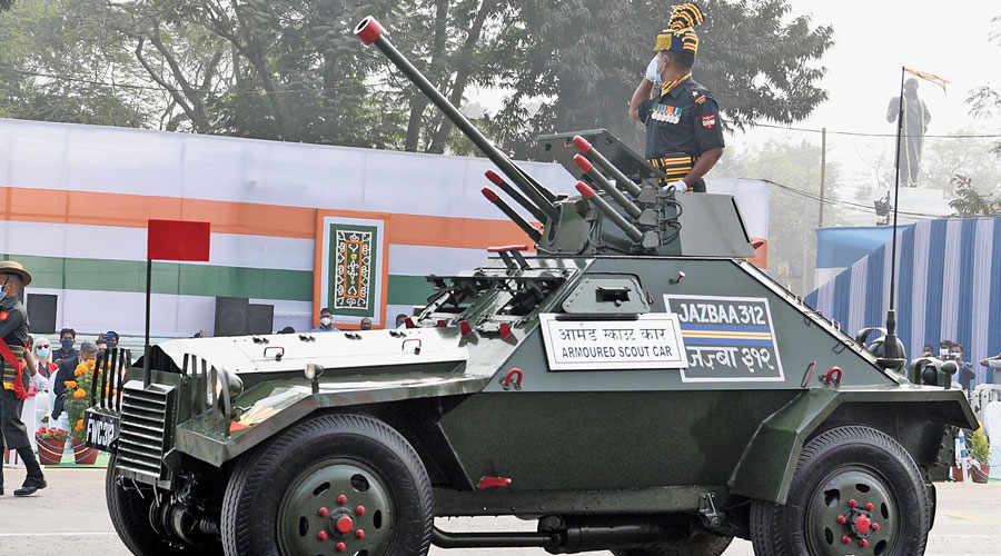 A jawan displays Armoured Scout Car on Red Road.