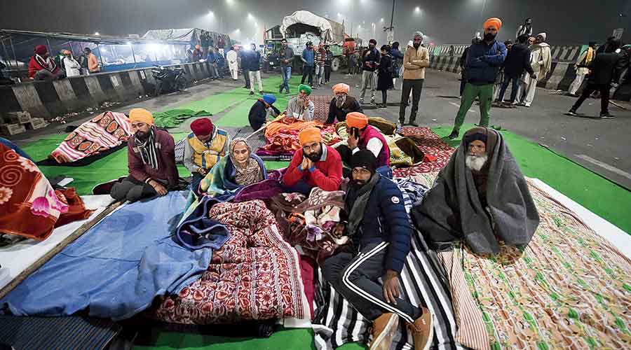 Farmers at the Ghazipur border on Thursday night. 