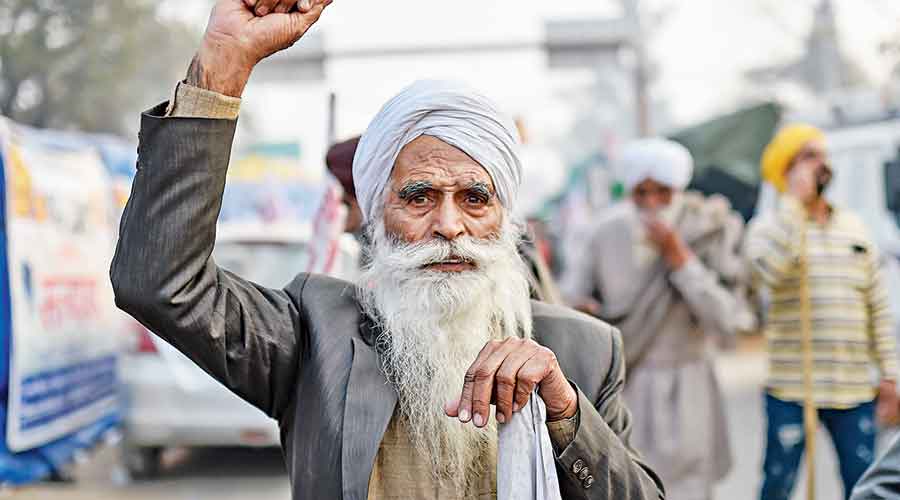 A farmer shouts slogans at the Singhu border  on Thursday. 