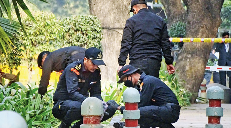 An NSG team inspects the blast site near the Israeli embassy in New Delhi on Saturday.