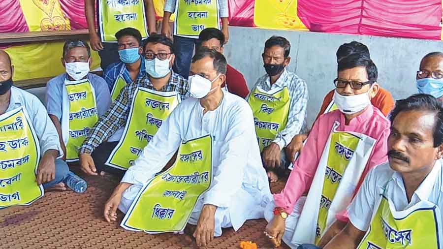 Rajbanshi community members protest at Khalisamari, Cooch Behar, on Sunday. 
