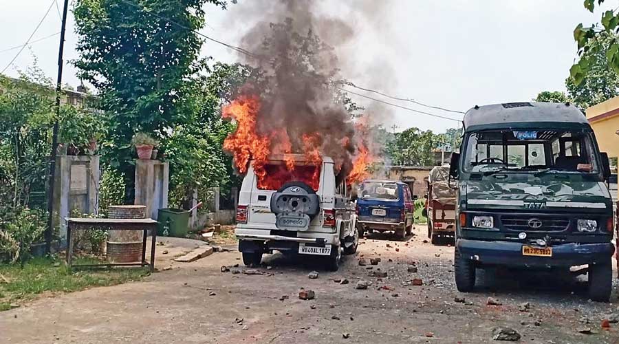 A vehicle set ablaze in the violence.