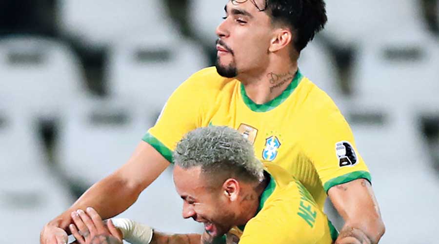 Lucas Paqueta celebrates with Neymar after scoring against Peru on Monday. 