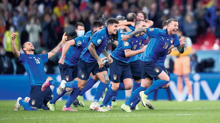 Italy players exult after Jorginho’s decisive penalty against Spain in the Euro 2020 semi-final shootout at Wembley Stadium on Tuesday. 