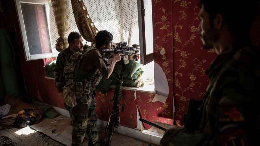 Afghan commandos at a front-line position in a home in Kunduz, Afghanistan on Tuesday, July 6, 2021.