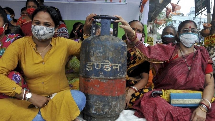 TMC activists protest against rising fuel prices in Calcutta on Saturday.