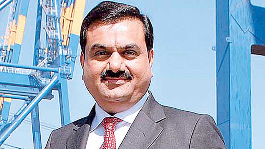 Indian Businessman Gautam Adani boards flight after getting off his BMW  7-Series