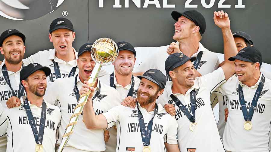 New Zealand captain Kane Williamson lifts the ICC World Test Championship Mace with teammates after beating  India in the final in Southampton last month. 