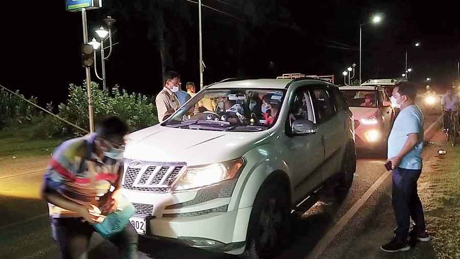 District officials and police check tourist vehicles in Digha on Friday night 