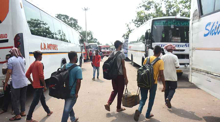 Passengers at the Bus Depot in Bartand, Dhanbad on Monday.
