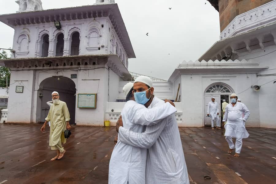 Muslim devotees greet each other after Eid-al-Adha prayers at Jama Masjid in Bhopal on Wednesday.