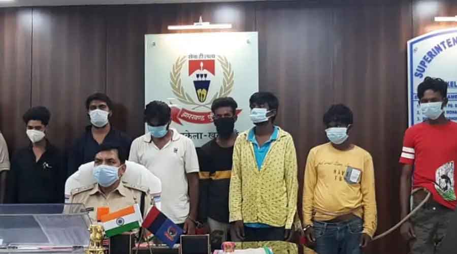 Seraikela-Kharsawan SP Anand Prakash with the seven arrested youths in Adityapur on Friday.