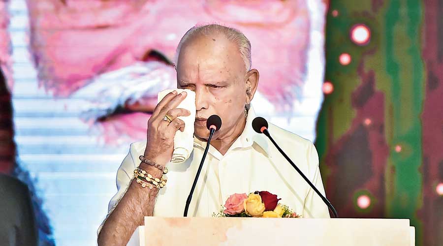 BS Yediyurappa wipes tears during a programme commemorating two years of the BJP government in Karnataka  at Vidhana Soudha in Bangalore on Monday
