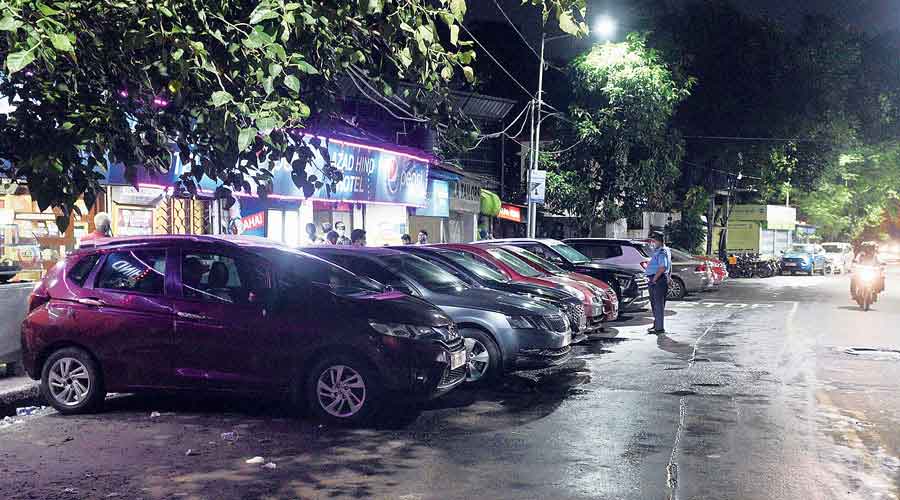 Cars parked in front of the eatery next to the IAS officers’ quarters at 10:30pm on Friday night.