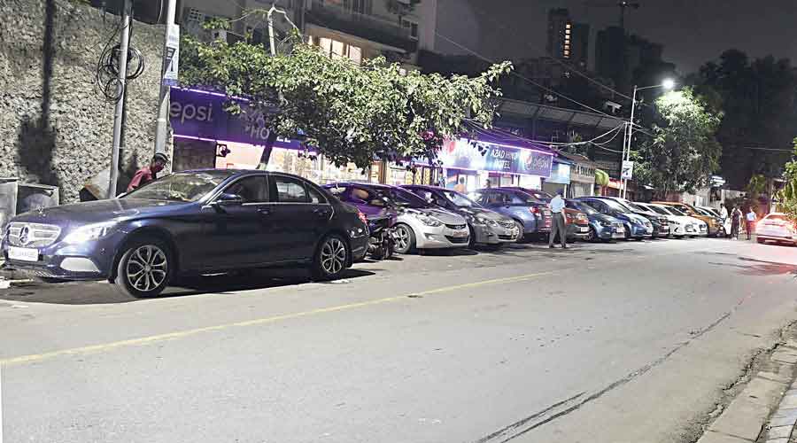 Vehicles in front of the eatery next to the IAS officers' quarters at 10:51 pm on Saturday night.