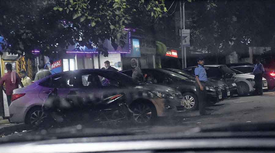 Vehicles in front of the eatery next to the IAS officers' quarters at 10:58 pm on Saturday night.