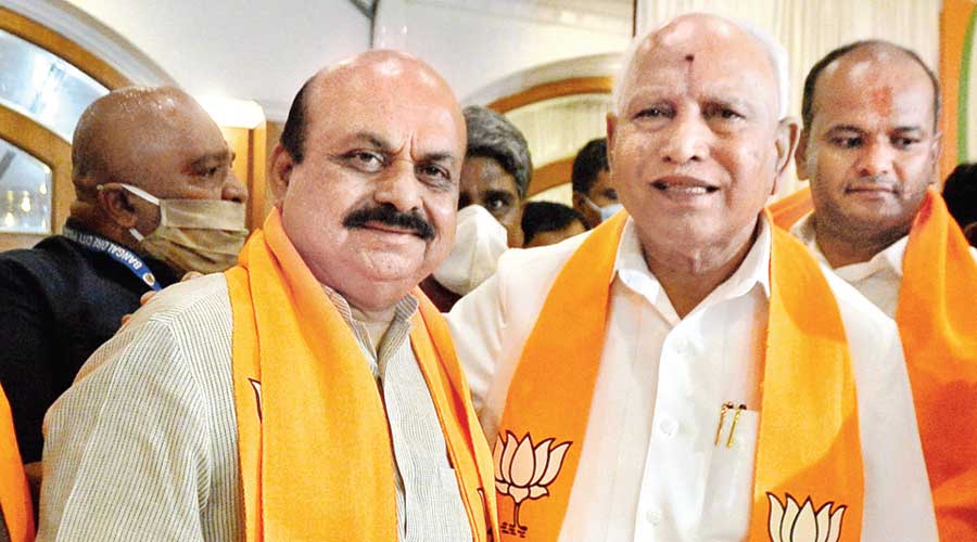 Basavaraj Bommai (left) with BS Yediyurappa after being chosen leader of the legislature party in Bangalore on Tuesday. 
