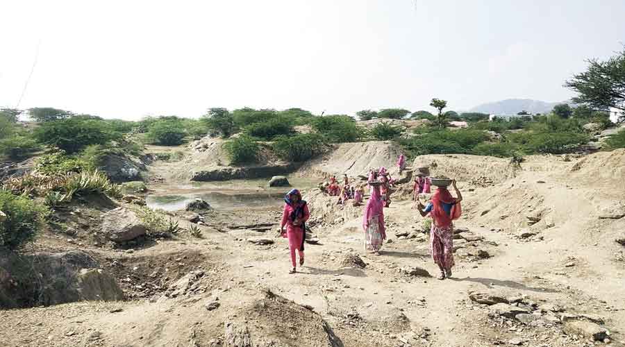 Workers construct a pond under the MGNREGA at Chatra in Jharkhand