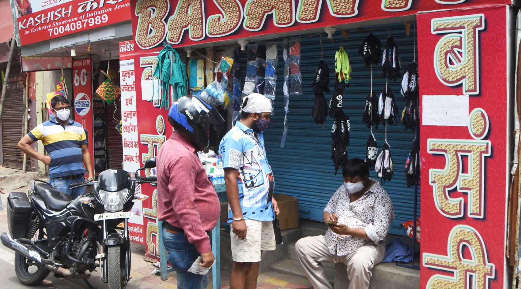 Sanjay Kumar Saw owner of the cosmetic shop 'Basanti' selling masks, sanitizers etc in front of his closed shop at Park Market in Hirapur, Dhanbad