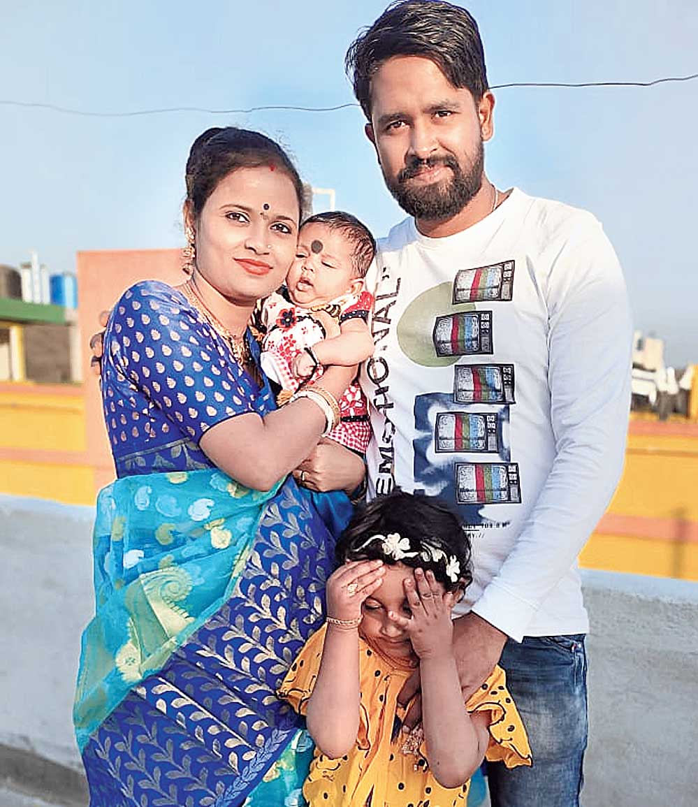 Loknath Das, with wife and children.