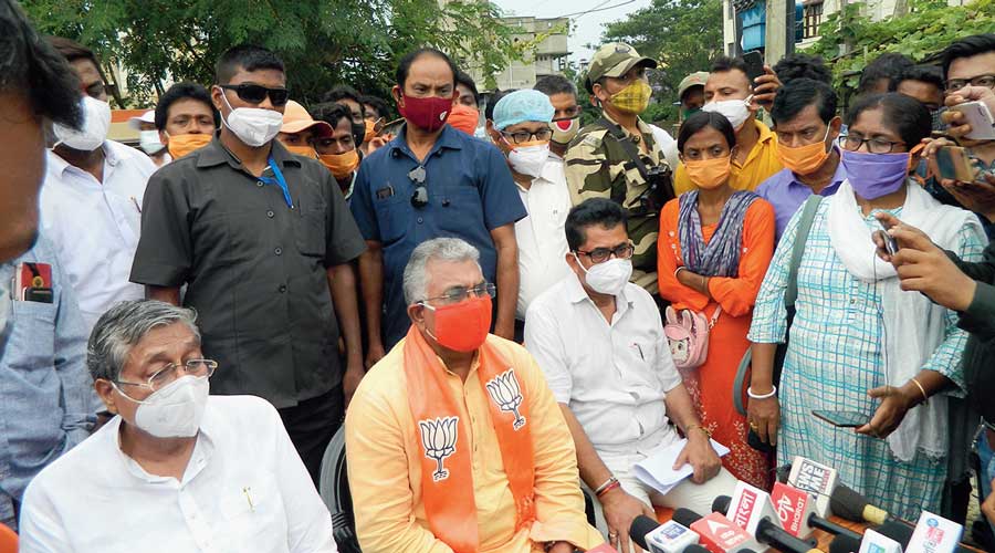 Dilip Ghosh (centre) addresses journalists outside the BJP office in Burdwan on Monday.