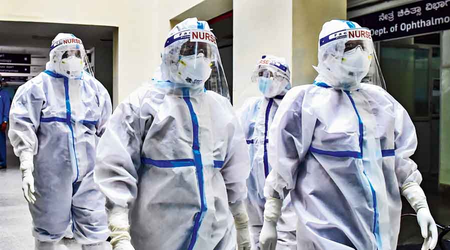 Nurses walk towards the Covid ward to  attend to patients. 