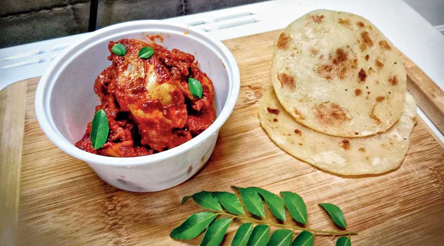 Chicken ghee roast with mini tawa parathas, from Aditya’s cloud kitchen.