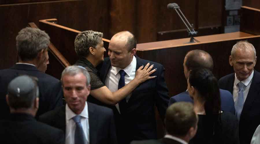 Naftali Bennett, center, before a vote during the Knesset session in Jerusalem