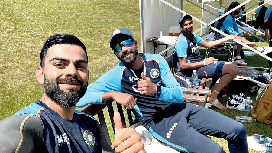 Virat Kohli with Mohammed Siraj and Ishant Sharma on Monday. 'These quicks are dominating everyday. Thumbs up,' tweeted Virat.