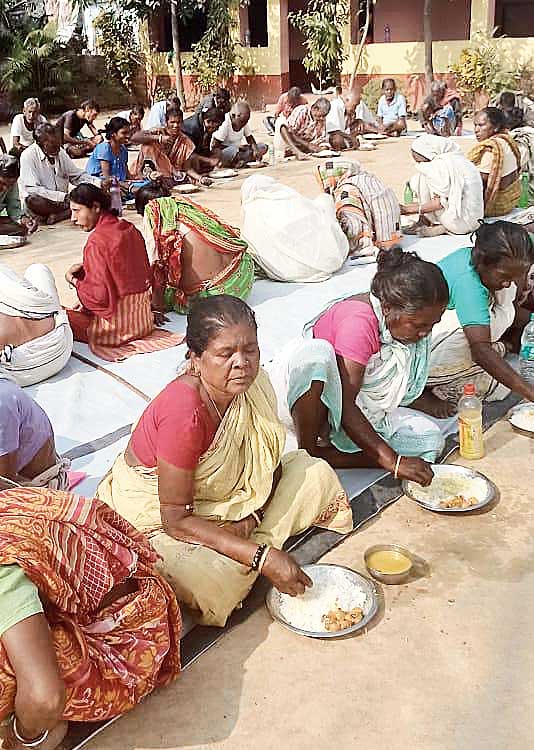 Villagers have lunch at the  community kitchen