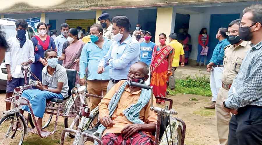 Tricycles being  distributed among the disabled at a vaccine centre in rural pocket of West Singhbhum district on Tuesday.