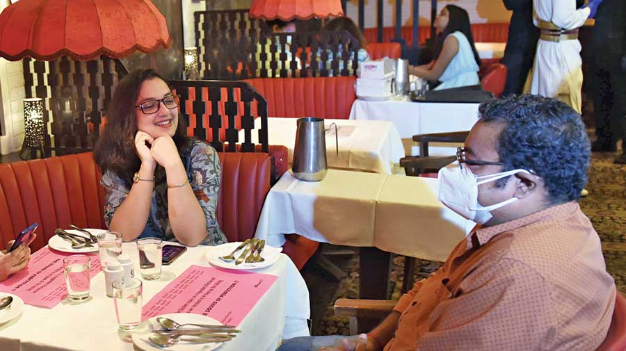 Lunch time at Mocambo  on Park Street on Wednesday, when restaurants  and malls resumed operations after remaining shut  to diners for a month and  a half. Day one was not very busy in terms of footfall,  especially in the absence  of public transport. The  diners were relieved to have stepped out after a long gap. A couple came to a Park Street restaurant after getting vaccinated at a corporate office in the same  neighbourhood. A junior doctor and  a digital marketer, childhood friends, met at South City Mall after three months. A couple with two children came to Quest Mall from  Salt Lake to buy toys and have a family dinner that had to be wrapped up by 8pm, according to the new norms. Many cancelled plans at home and stepped out to celebrate Jamai Sashthi. An ethnic wear store in South City Mall saw one purchase till 3pm on Wednesday — a man buying a kurta for his son-in-law on Jamai Sashthi. “One buyer is nothing. But it’s a start, after all,” said Naushad Alam, one of the two executives at the store. Their May income had been zero since the store was shut.  