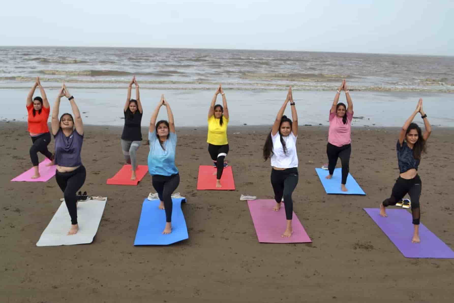 Surat women perform Yoga at a beach on Saturday.