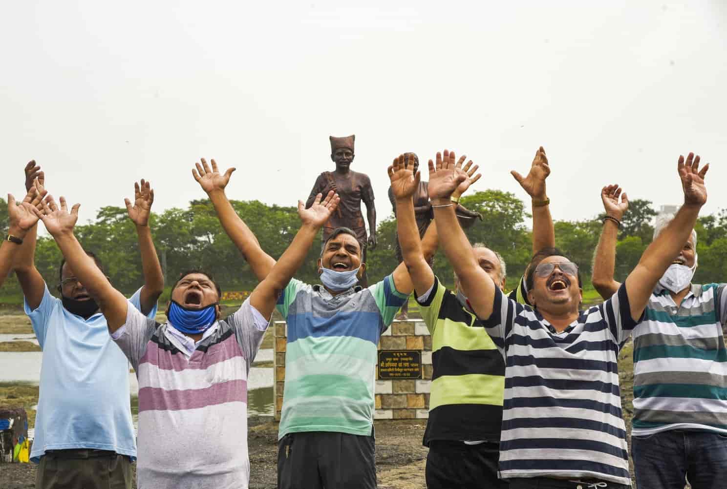 People perform Yoga at Mumbai's Mini Seashore on Saturday morning.