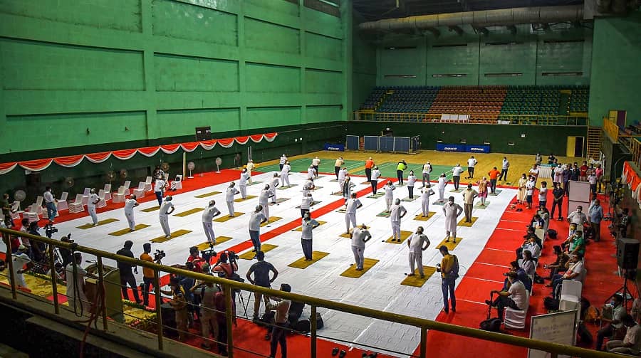 Assam Health Minister Keshab Mahanta along with others perform Yoga on International Day of Yoga, at Deshbhakta Tarun Ram Phookan Indoor Stadium in Guwahati on Monday.