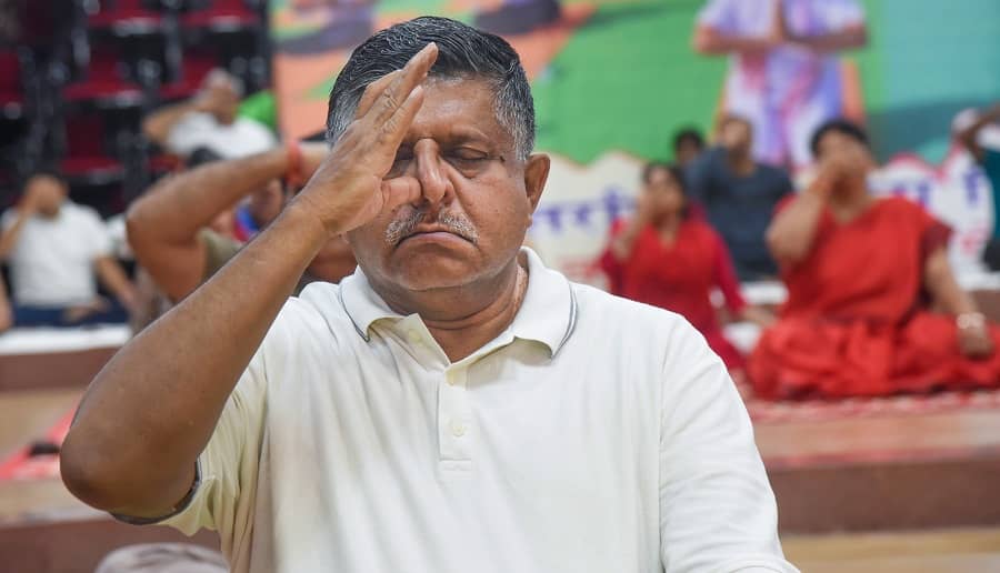 Union Law and IT Minister Ravi Shankar Prasad performs Yoga on the occasion of International Day of Yoga, in Patna on Monday.