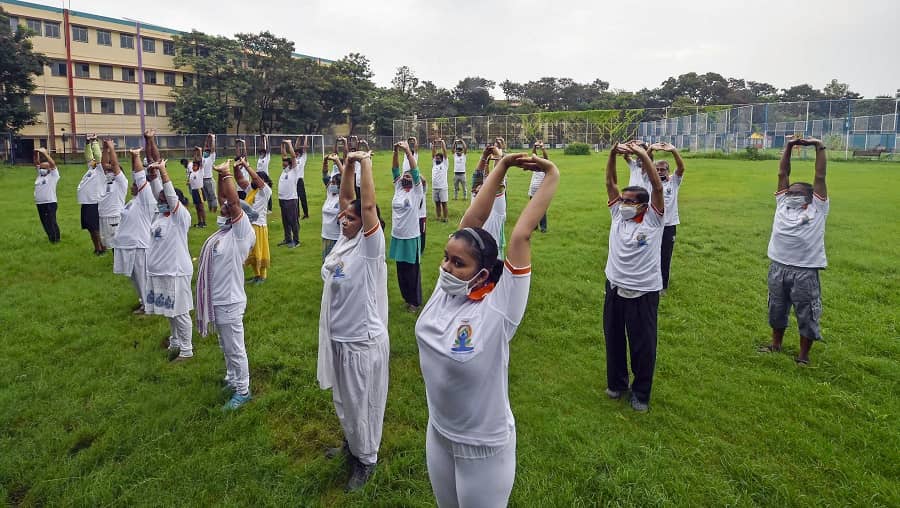 People perform Yoga on the occasion of International Day of Yoga, in Calcutta on Monday.