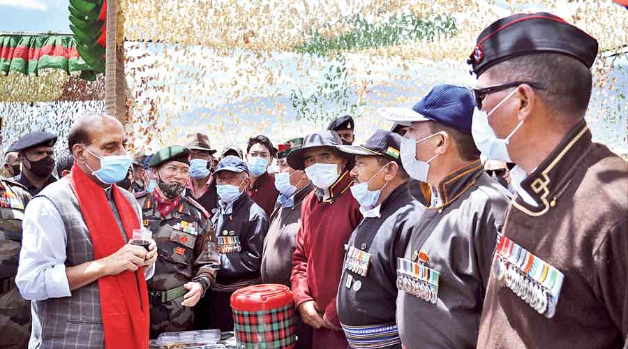 Rajnath Singh interacts  with the army veterans in Leh on Sunday